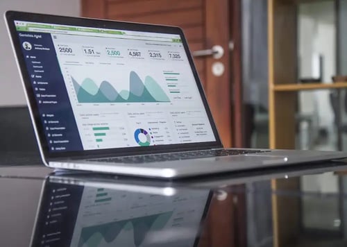 Charts and graphics on laptop-unsplash