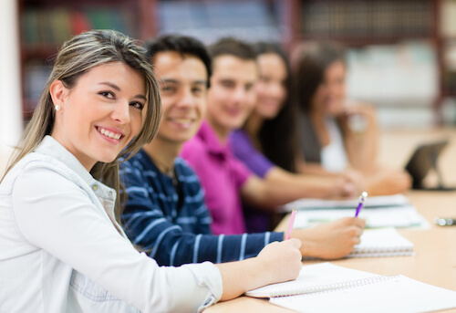 Group of students in class taking notes