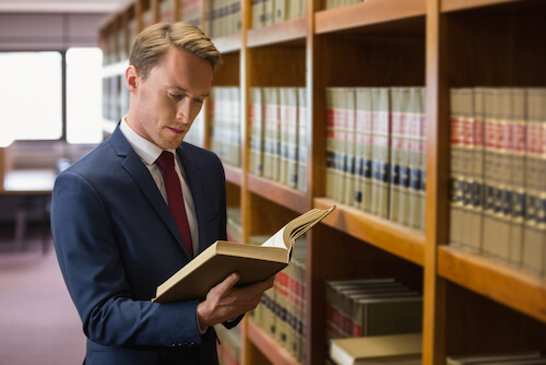 Handsome lawyer in the law library at the university