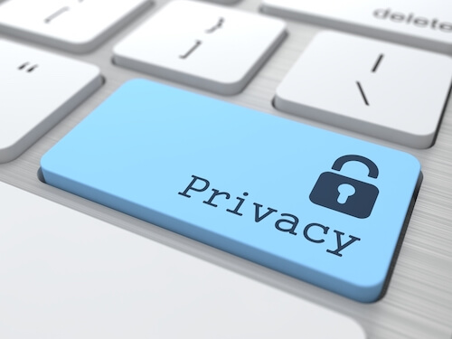 Privacy Concept. Blue Button with Padlock Icon on Modern Computer Keyboard. 3D Render.-1
