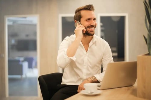 Smart casual man on the phone-unsplash