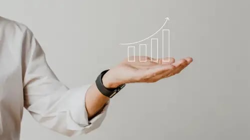 digital-increasing-bar-graph-with-businessman-hand-overlay