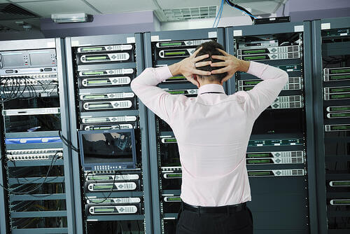 it business man in network server room have problems and looking for  disaster situation  solution-1