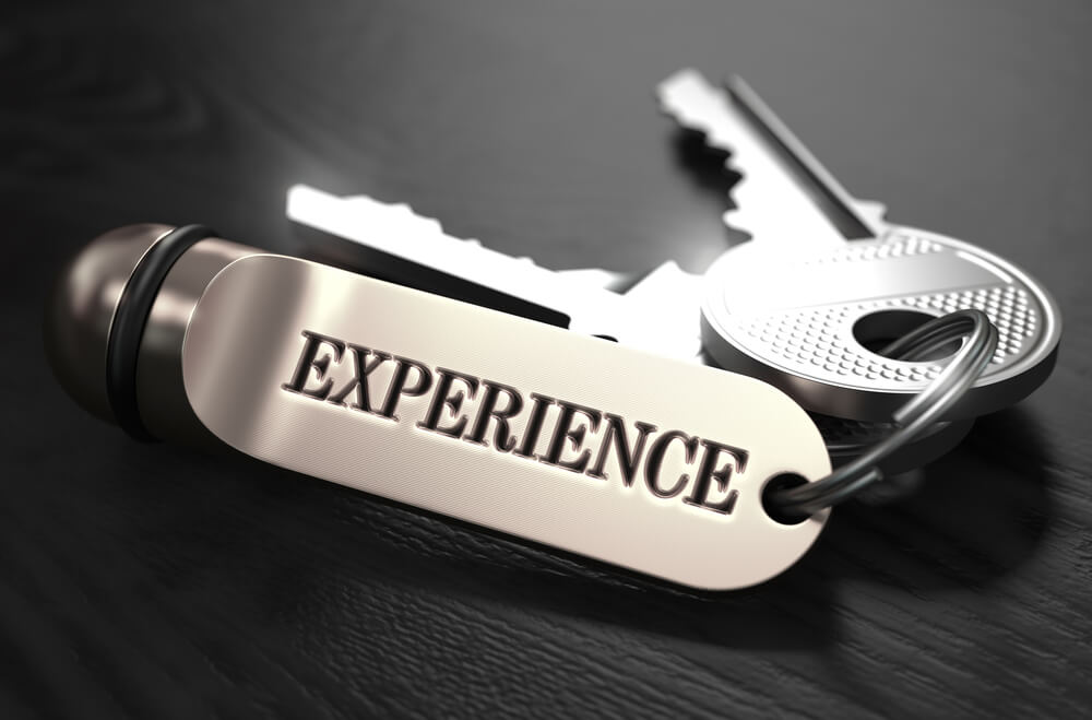 Experience Concept. Keys with Keyring on Black Wooden Table. Closeup View, Selective Focus, 3D Render. Black and White Image.-1