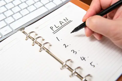 close-up-businessman-s-hand-writing-plan-list-diary